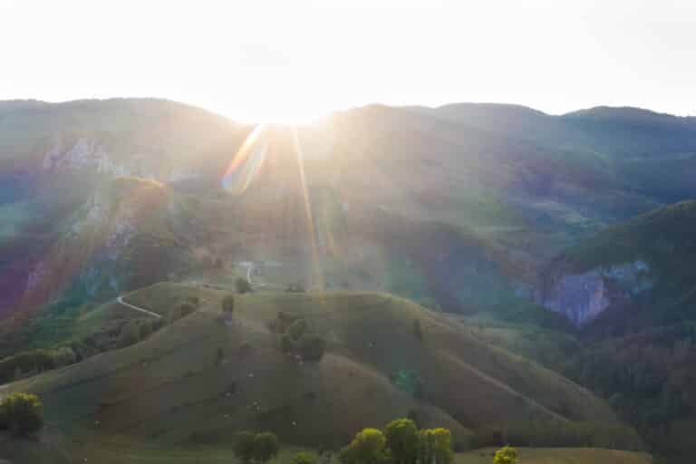 Drone view of beautiful summer sunrise over Transylvanian mounta